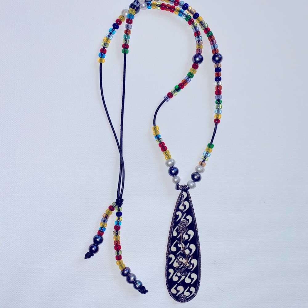 Beaded necklace with diamond pendant